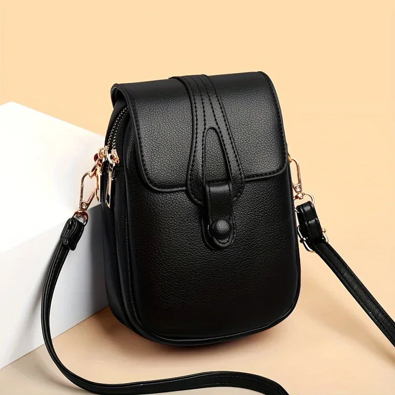 Women's Compact Leather Crossbody Bag with Minimalist Design and Adjustable Strap!